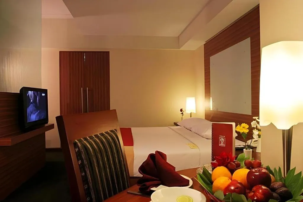 Bed in Hotel Pangeran