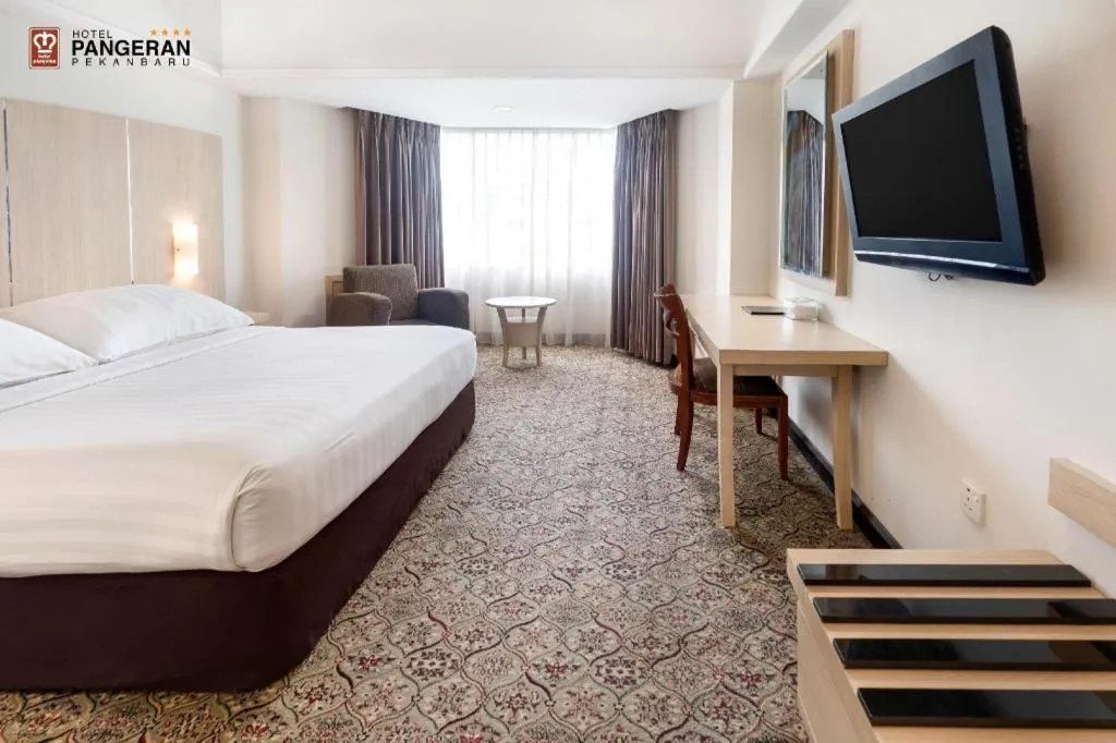 Bed in Hotel Pangeran