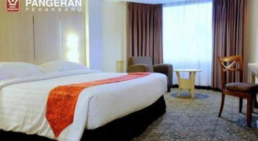 Bed in Hotel Pangeran