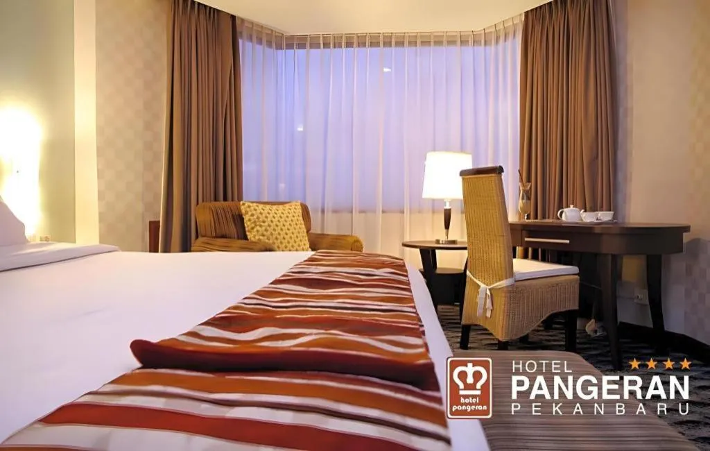 Bed in Hotel Pangeran