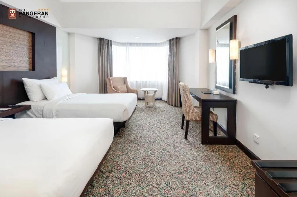 Bed in Hotel Pangeran