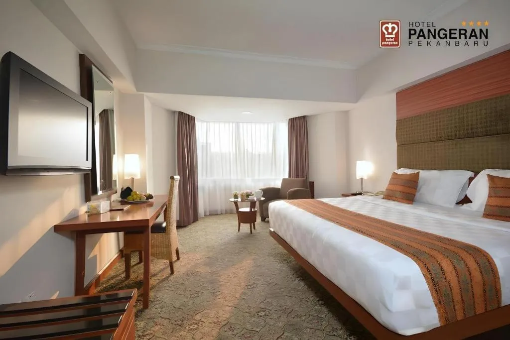 Bed in Hotel Pangeran