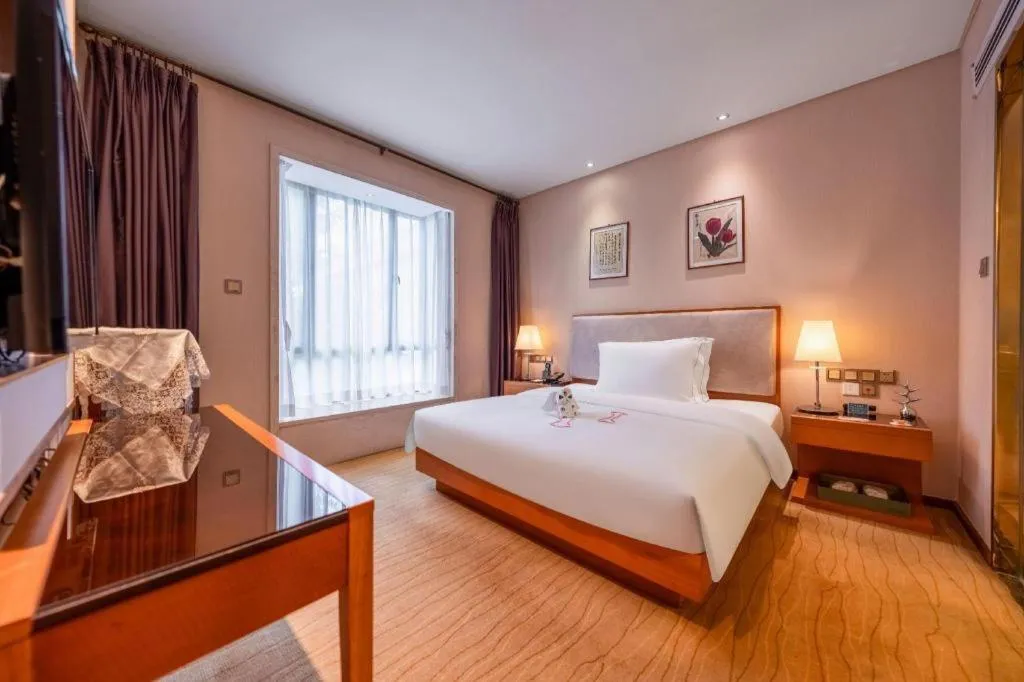 Bed in Expo Garden Hotel