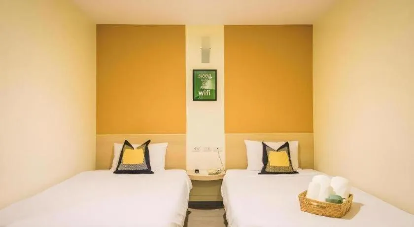 Bed in New Suanmali Hotel