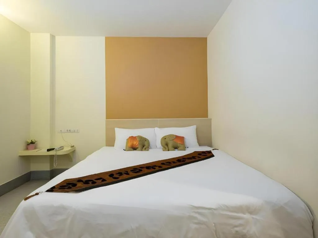 Bed in New Suanmali Hotel