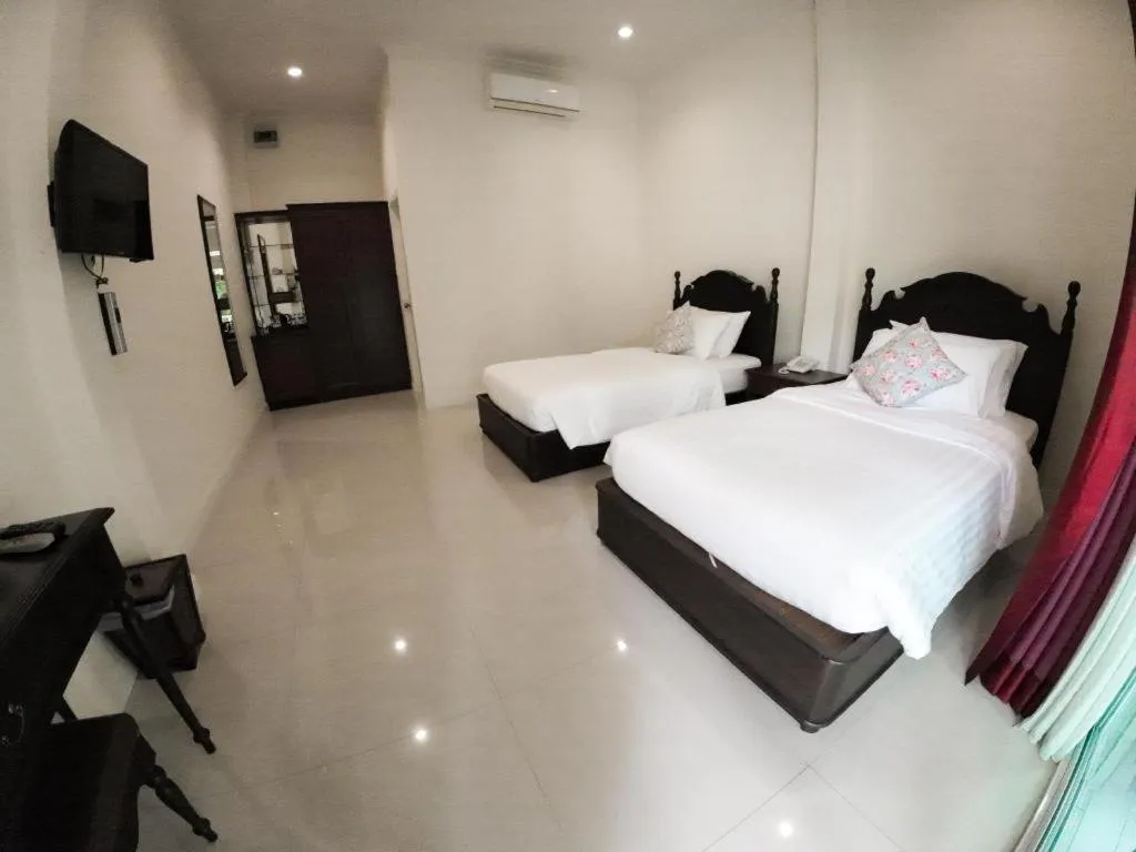 Bed in Ruen Maihom Riverside Cottage