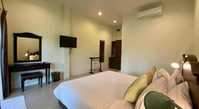 Bed in Ruen Maihom Riverside Cottage