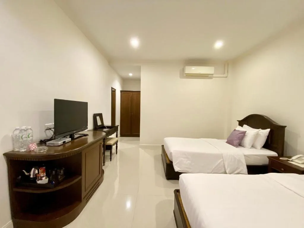 Bed in Ruen Maihom Riverside Cottage