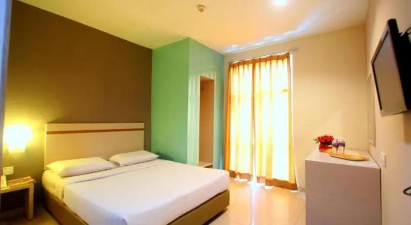 Bed in Lovina Inn Penuin Hotel