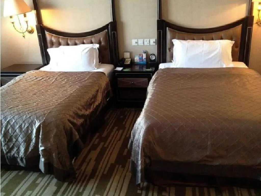 Bed in Qingdao Danube International Hotel