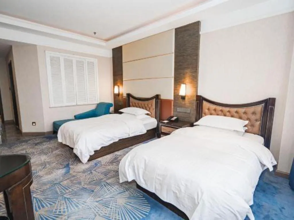 Bed in Qingdao Danube International Hotel