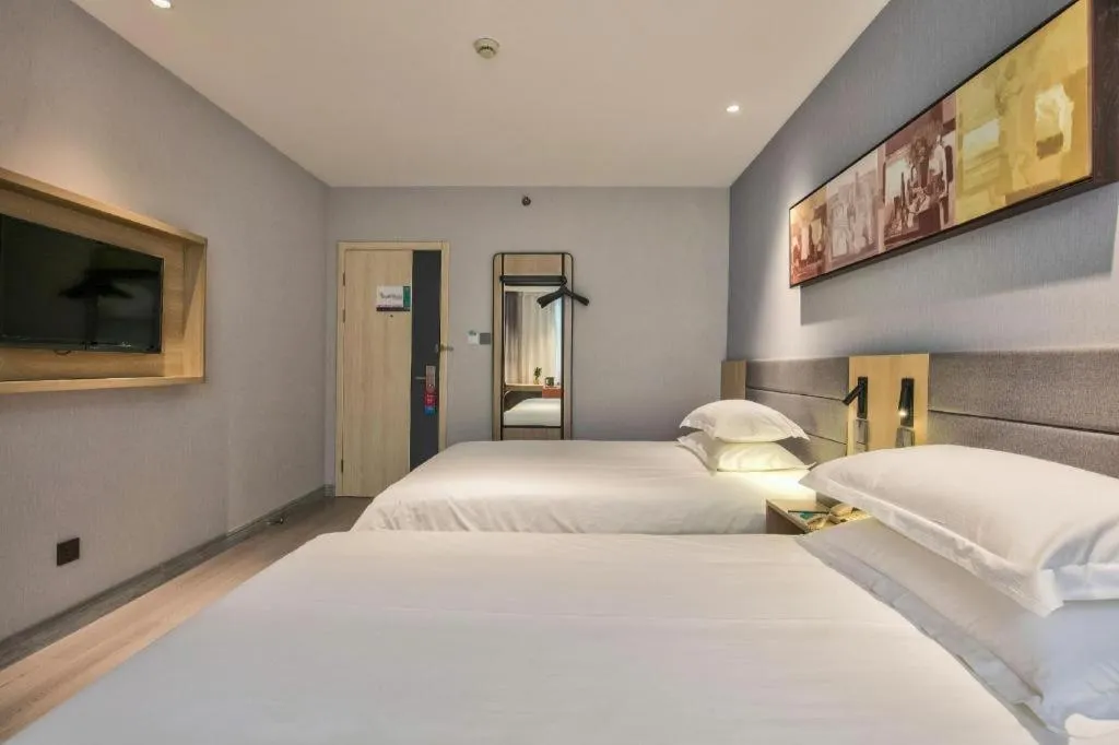 Bed in Jinjiang Inn Taizhou Huangyan Jiufeng Park