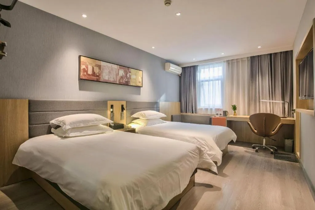 Bed in Jinjiang Inn Taizhou Huangyan Jiufeng Park