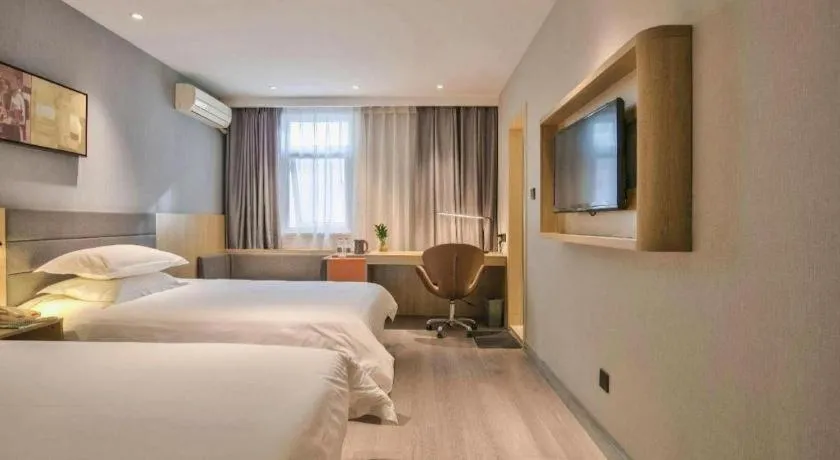 Bed in Jinjiang Inn Taizhou Huangyan Jiufeng Park