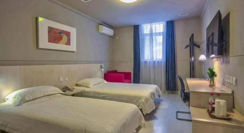 Bed in Jinjiang Inn Taizhou Huangyan Jiufeng Park