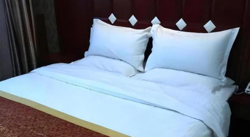 Bed in Shell Hotel Taiyuan South Railway Station New Southeast Bus Station