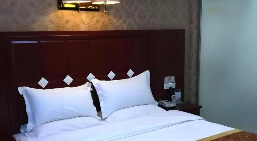 Bed in Shell Hotel Taiyuan South Railway Station New Southeast Bus Station