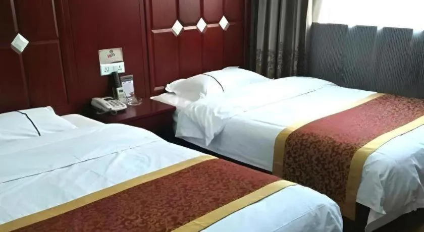 Bed in Shell Hotel Taiyuan South Railway Station New Southeast Bus Station