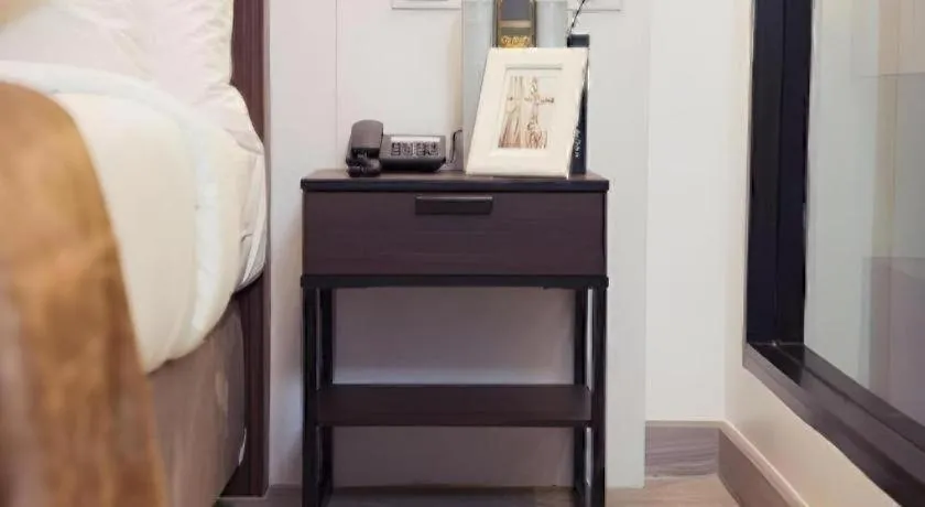 Bed in Thaisun Bangkok Hotel