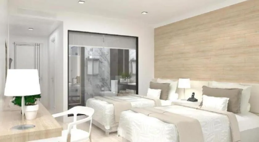 Bed in Thaisun Bangkok Hotel