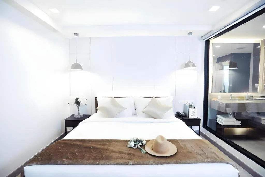 Bed in Thaisun Bangkok Hotel