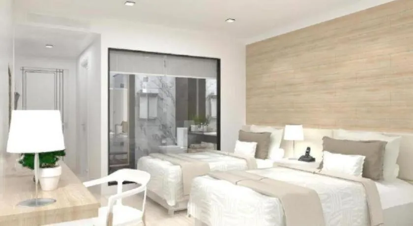 Bed in Thaisun Bangkok Hotel