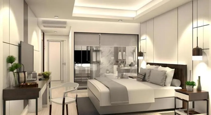 Bed in Thaisun Bangkok Hotel