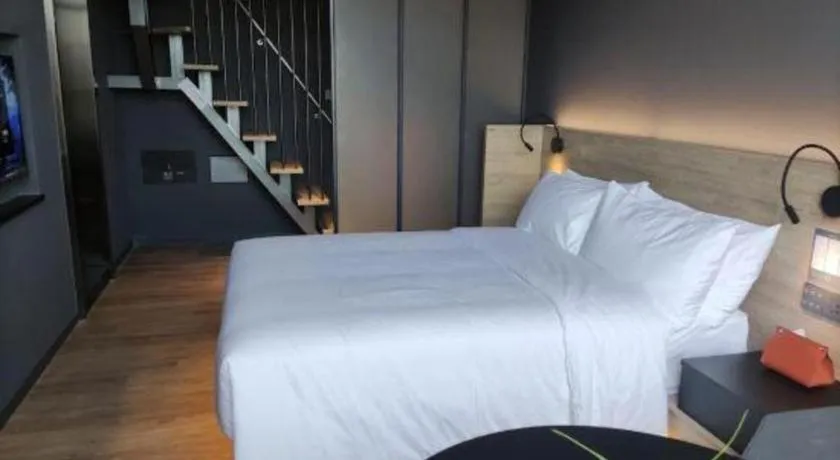 Bed in Opus Hotel Jiangmen