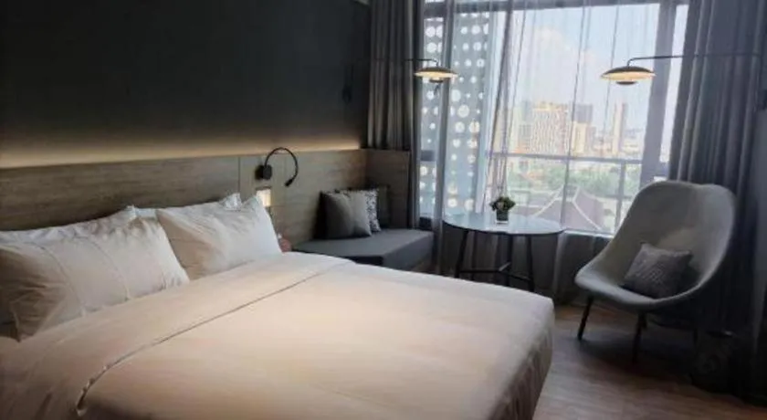 Bed in Opus Hotel Jiangmen