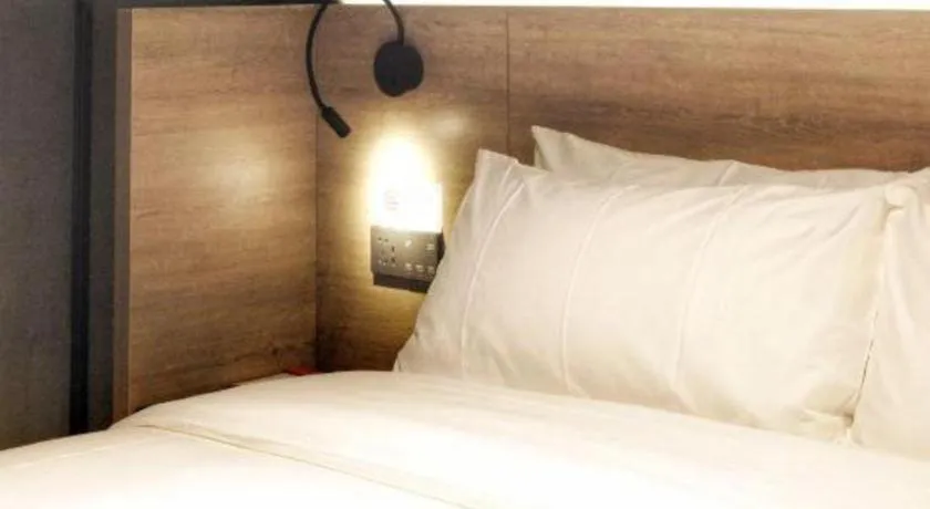 Bed in Opus Hotel Jiangmen