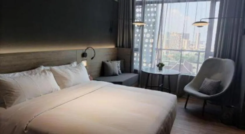 Bed in Opus Hotel Jiangmen