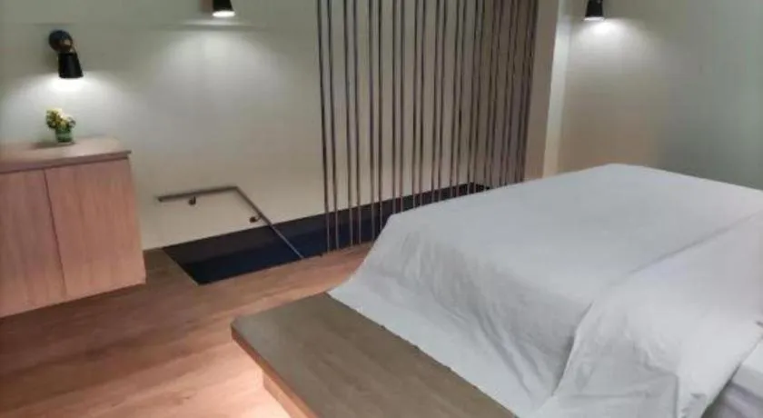 Bed in Opus Hotel Jiangmen