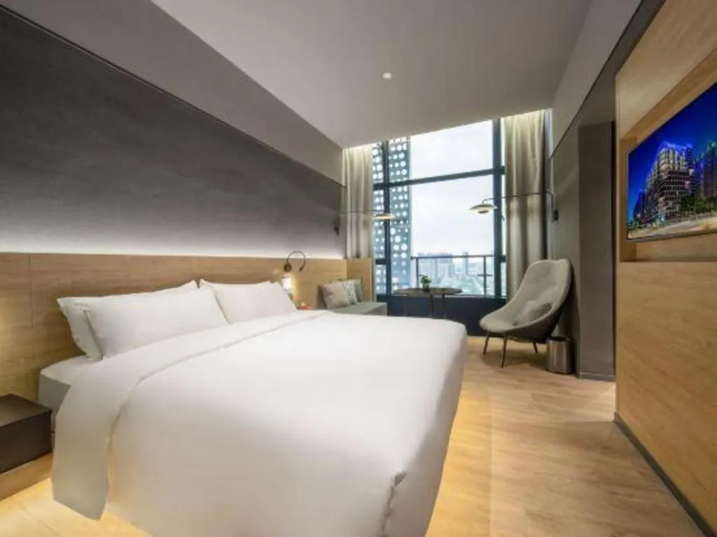 Bed in Opus Hotel Jiangmen