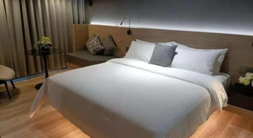 Bed in Opus Hotel Jiangmen