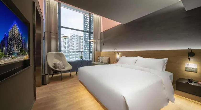 Bed in Opus Hotel Jiangmen