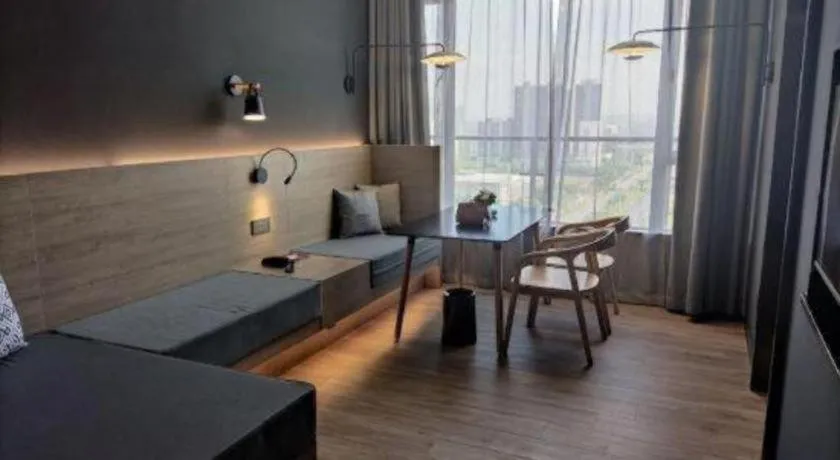 Bed in Opus Hotel Jiangmen