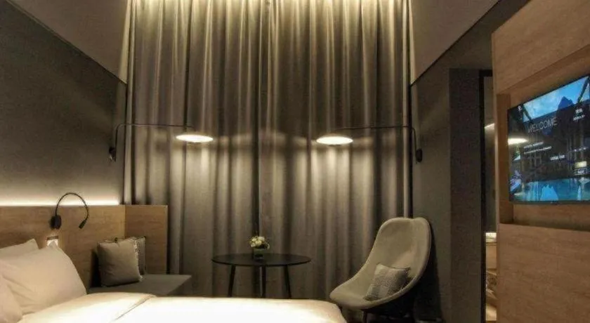 Bed in Opus Hotel Jiangmen