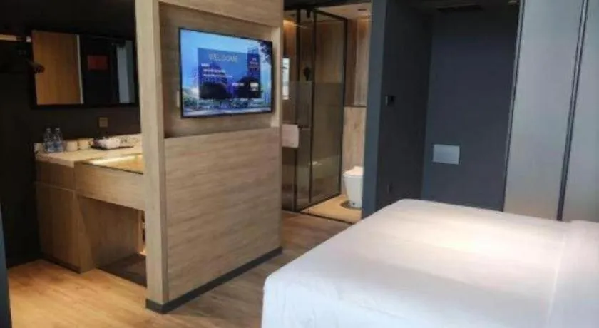 Bed in Opus Hotel Jiangmen