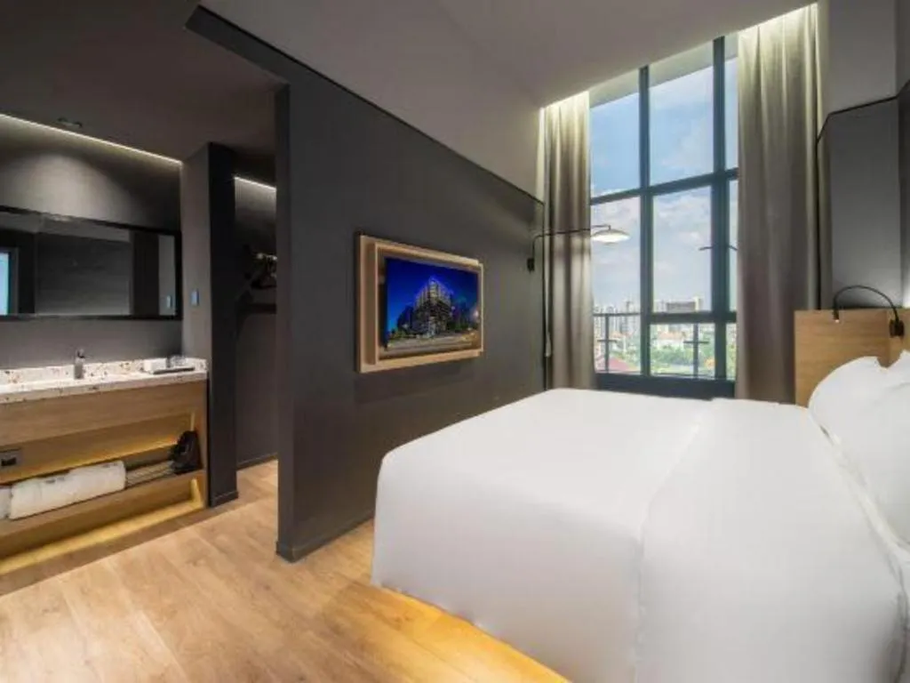 Bed in Opus Hotel Jiangmen