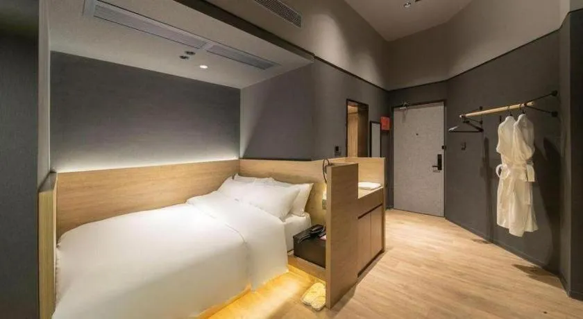 Bed in Opus Hotel Jiangmen