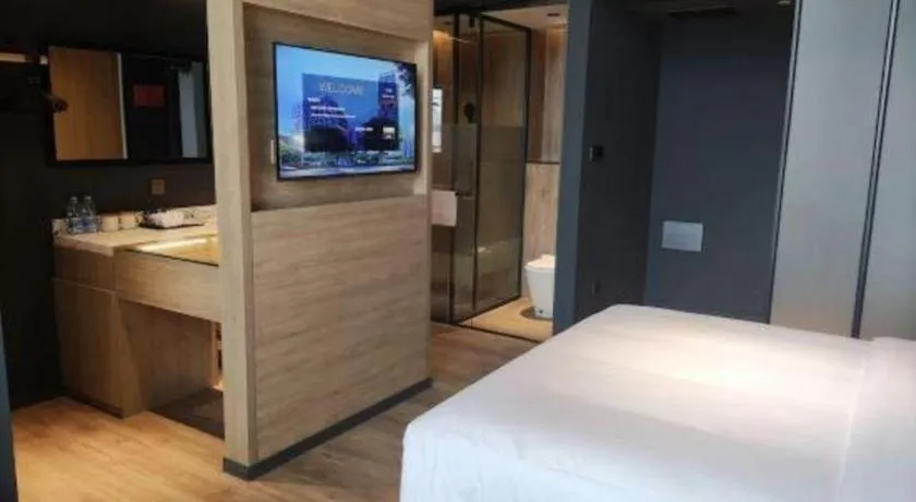 Bed in Opus Hotel Jiangmen