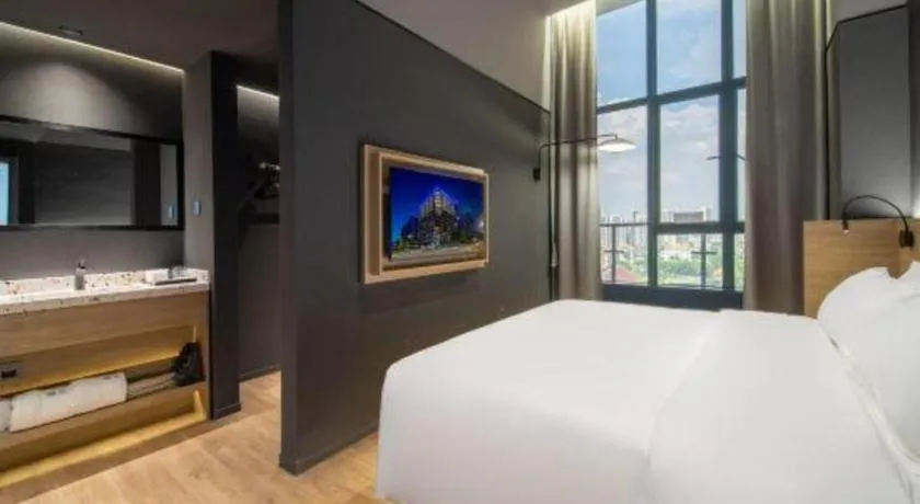 Bed in Opus Hotel Jiangmen