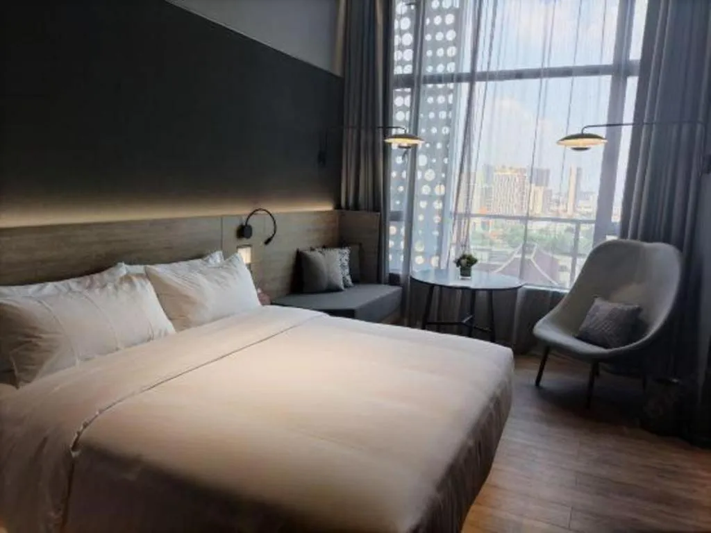 Bed in Opus Hotel Jiangmen