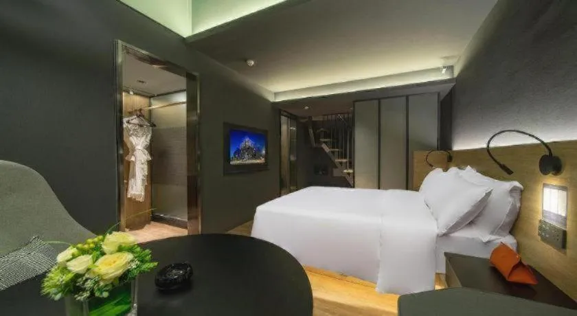 Bed in Opus Hotel Jiangmen