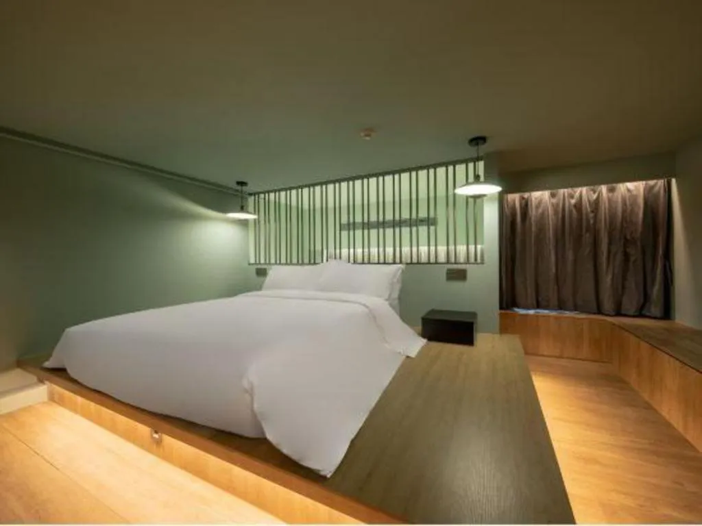 Bed in Opus Hotel Jiangmen