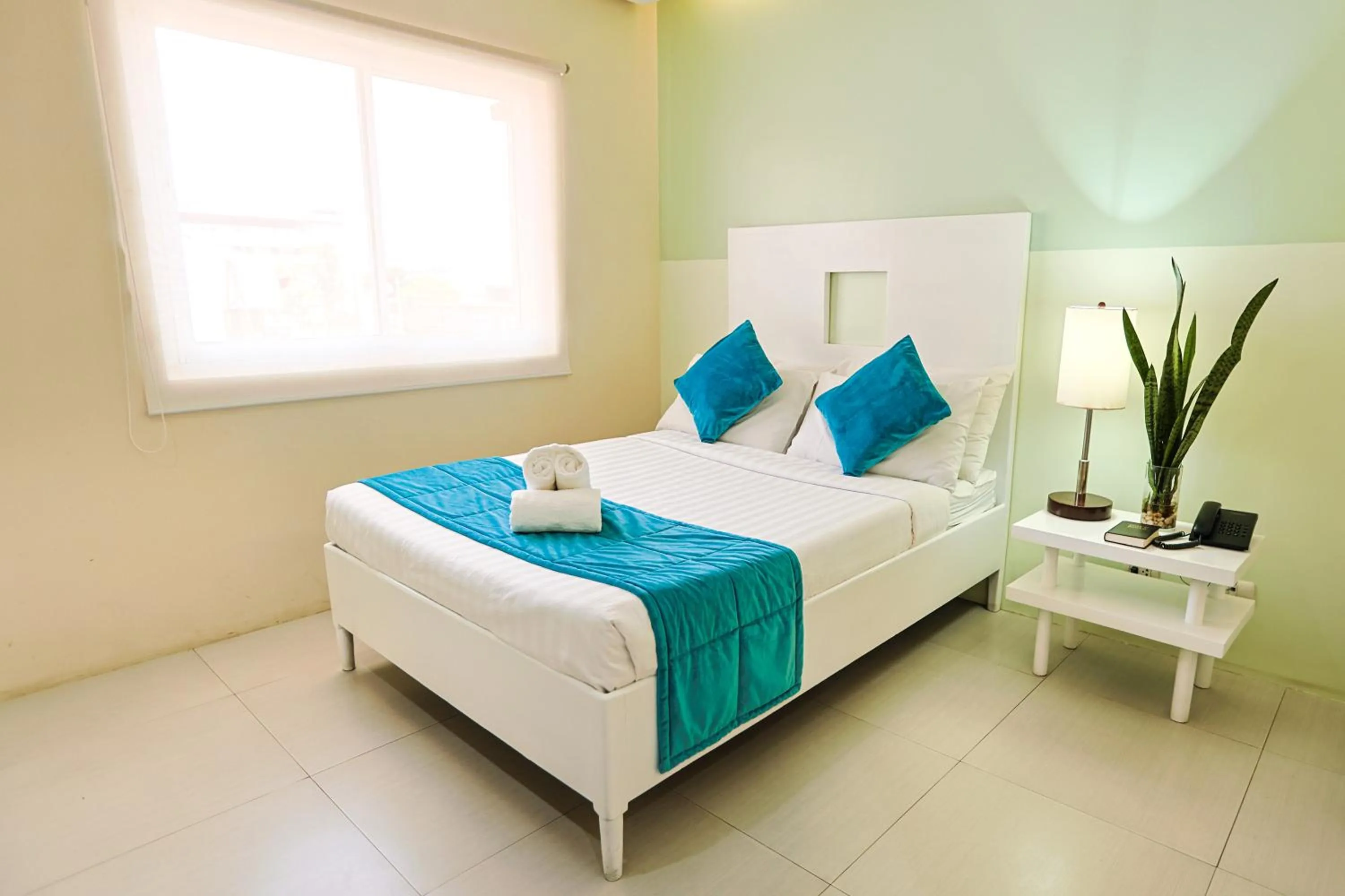 Bedroom, Bed in Holiday Suites Business District - formerly Empire Suites Hotel