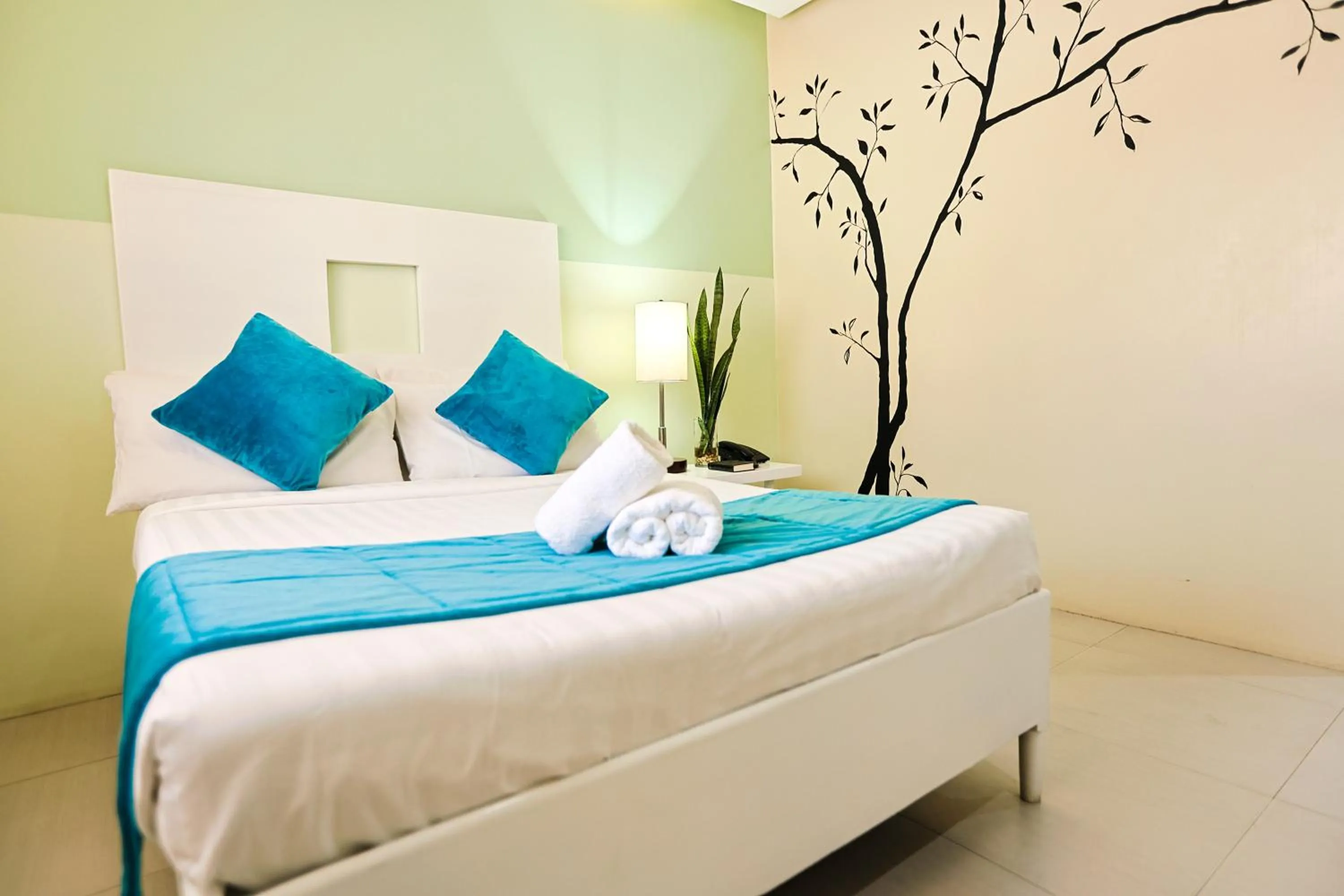 Bedroom, Bed in Holiday Suites Business District - formerly Empire Suites Hotel