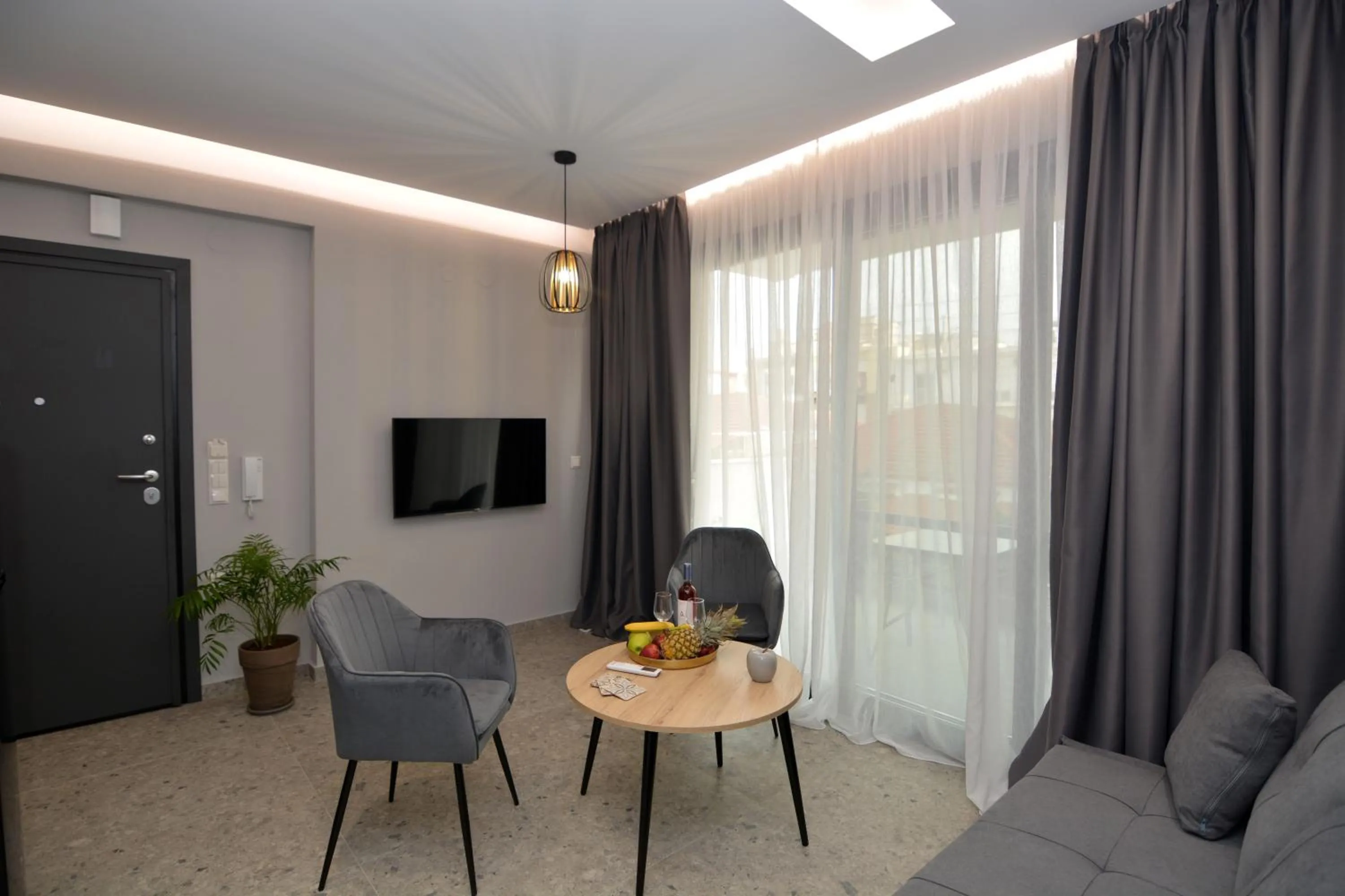 Communal lounge/ TV room in Mavili Luxury Apartments