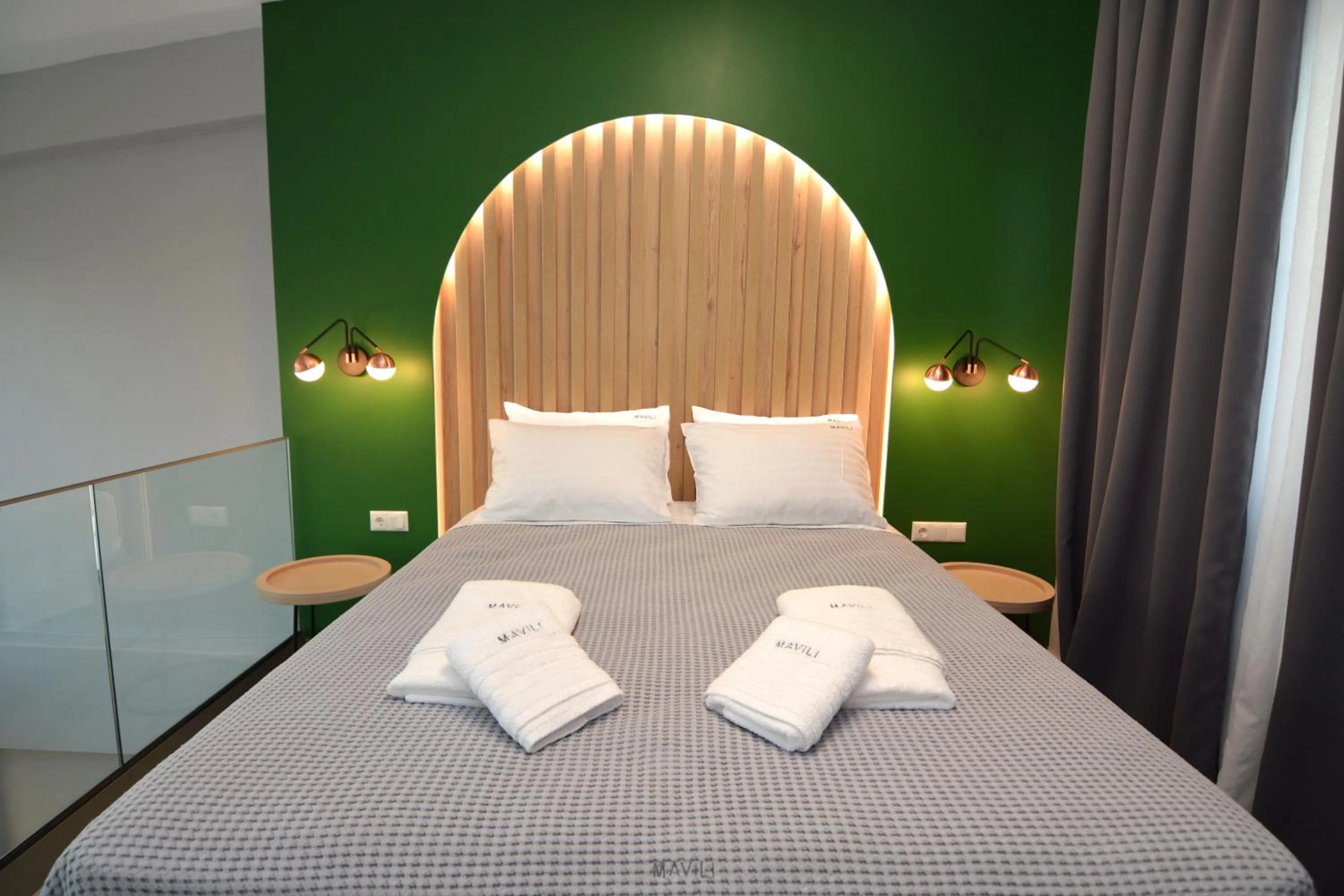 Bed in Mavili Luxury Apartments