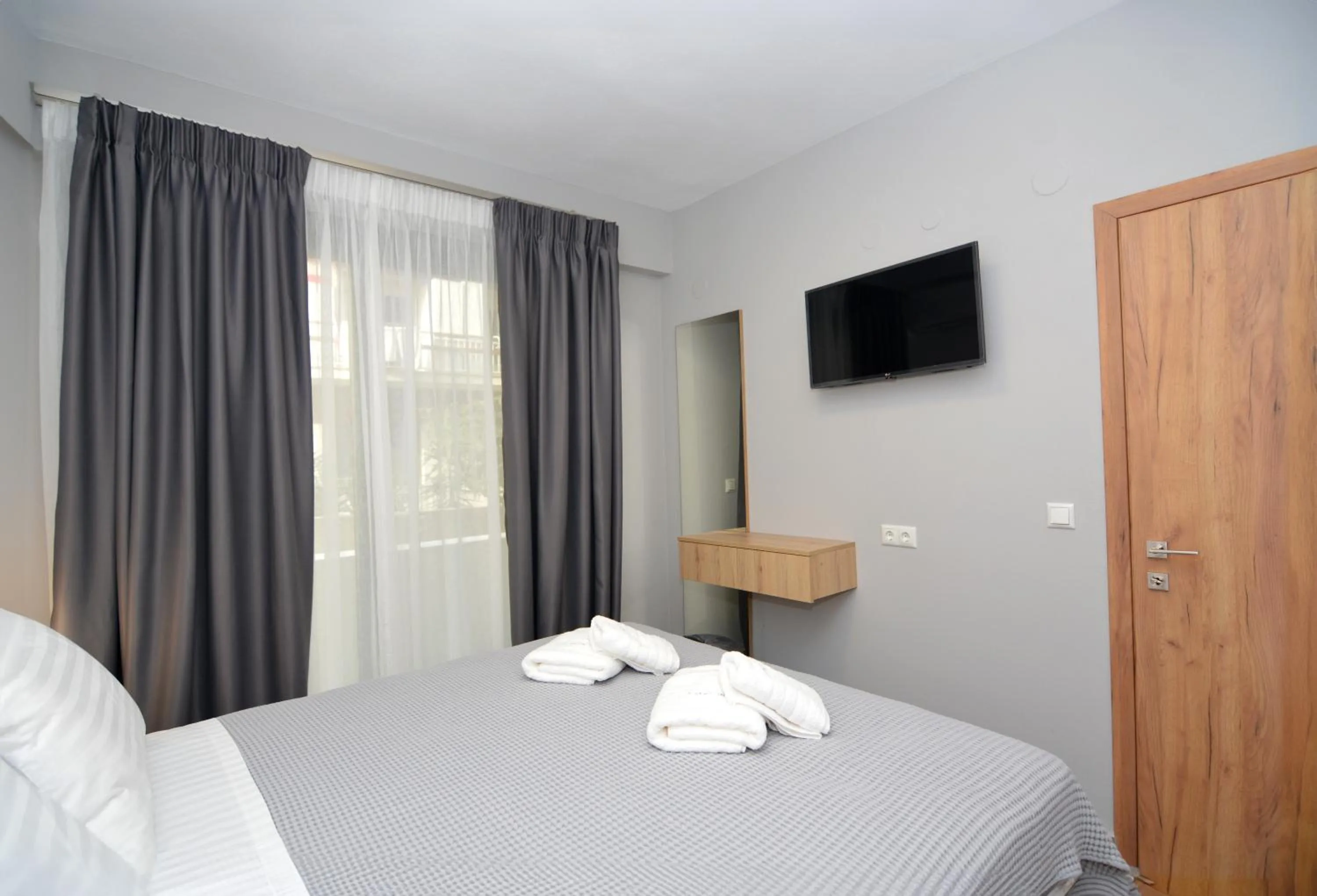 Bed in Mavili Luxury Apartments